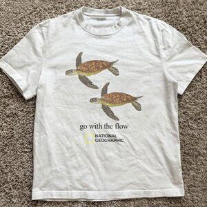 White National Geographic turtle “go tied the flow” tee